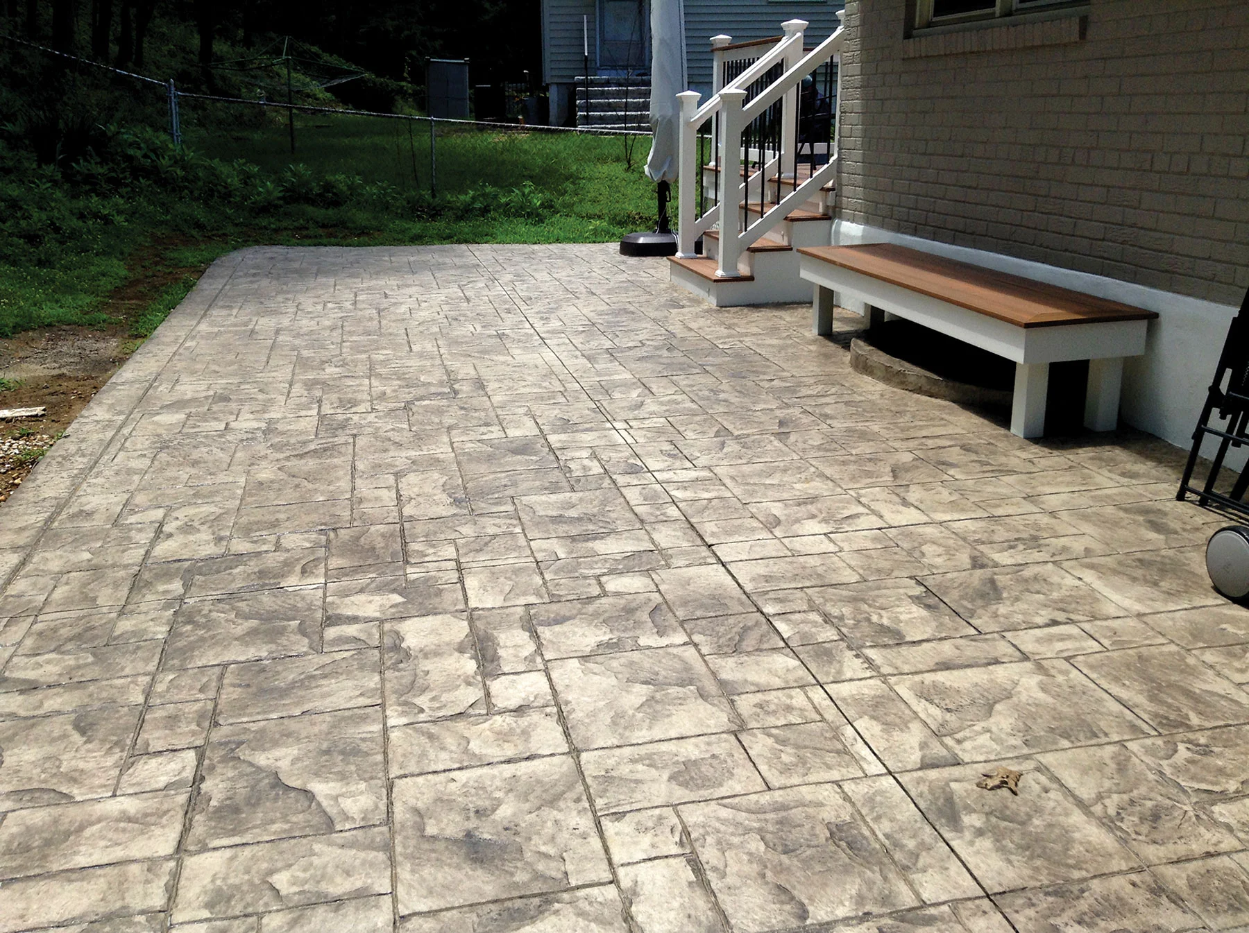 Stamped concrete patio with light color hardener — Las Vegas residential